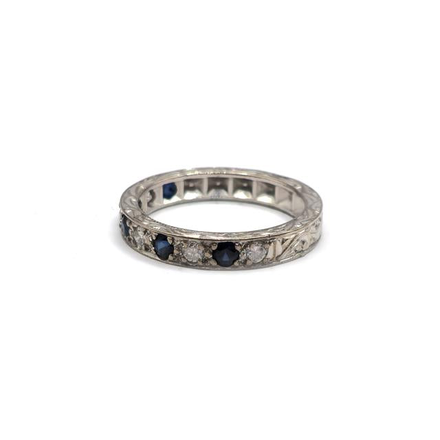 18ct white gold diamond and sapphire half eternity ring with alternating gemstones, elegant jewelry piece with sparkling stones.