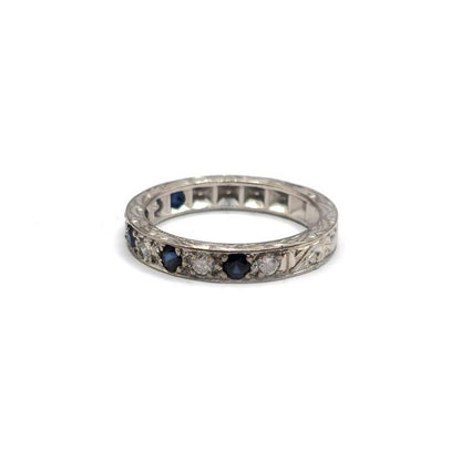 18ct white gold diamond and sapphire half eternity ring with alternating gemstones, elegant jewelry piece with sparkling stones.