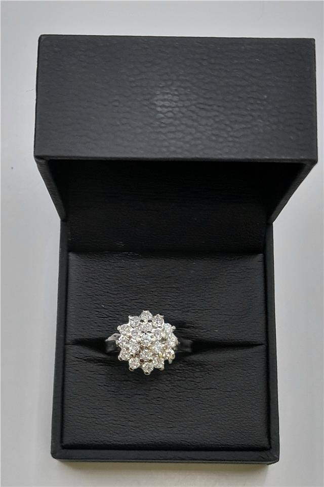 18ct white gold diamond cluster ring in size L with sparkling diamonds, elegant jewelry piece.
