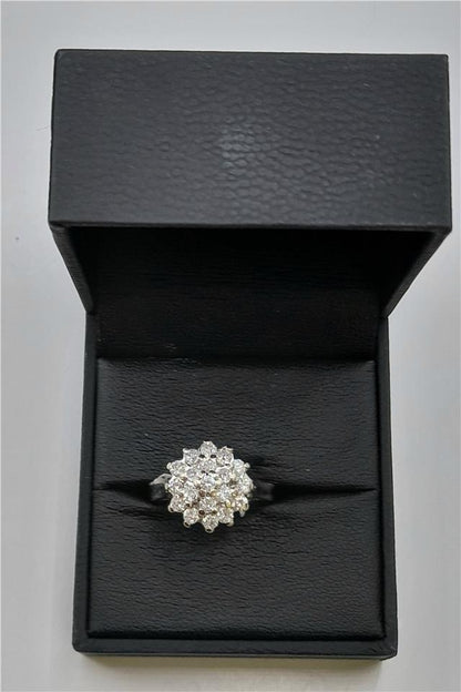 18ct white gold diamond cluster ring in size L with sparkling diamonds, elegant jewelry piece.
