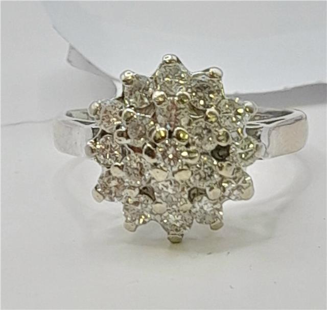 18ct white gold diamond cluster ring in size L with sparkling diamond accents, showcasing elegant craftsmanship and design.