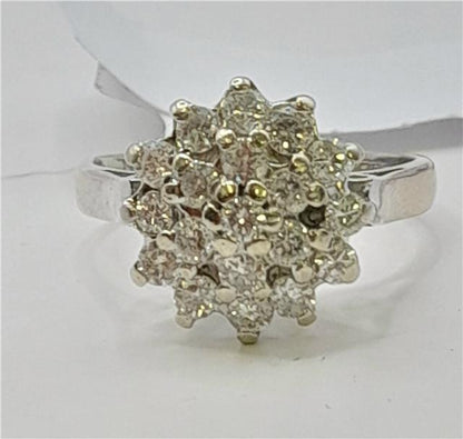 18ct white gold diamond cluster ring in size L with sparkling diamond accents, showcasing elegant craftsmanship and design.