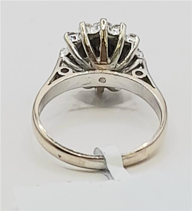 18ct white gold diamond cluster ring in size L with sparkling diamond accents, elegant jewelry piece.