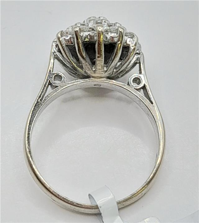 18ct white gold diamond cluster ring in size L with sparkling diamonds and intricate design.