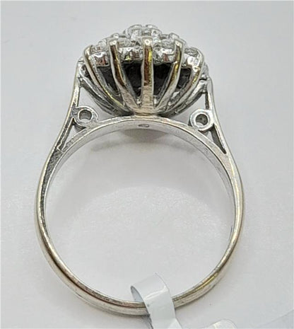 18ct white gold diamond cluster ring in size L with sparkling diamonds and intricate design.