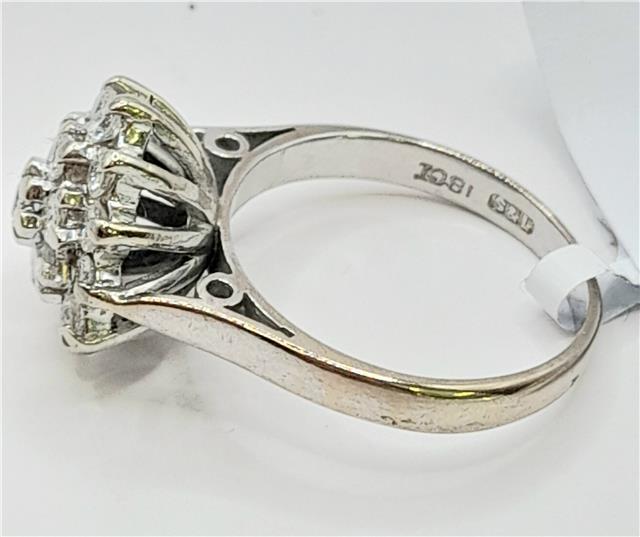 18ct white gold diamond cluster ring in size L, featuring a sparkling diamond design on a sleek unbranded ring.