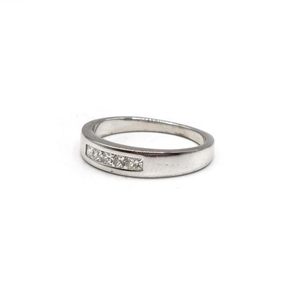 18ct white gold diamond ring with a sparkling central diamond, elegant design, unbranded jewelry for special occasions.