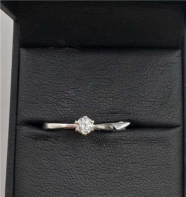 18ct white gold diamond ring in size I 1/2 featuring sparkling diamonds on a sleek band.