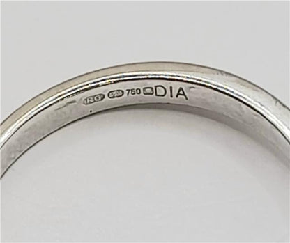 18ct white gold diamond ring in size I 1/2 with sparkling diamonds, showcasing elegant craftsmanship and luxurious design.