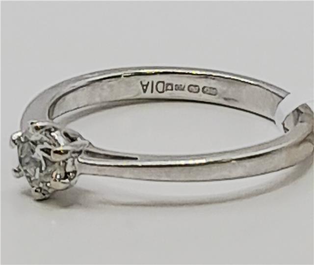 18ct white gold diamond ring in size I 1/2 with sparkling diamonds, showcasing elegant jewelry craftsmanship.