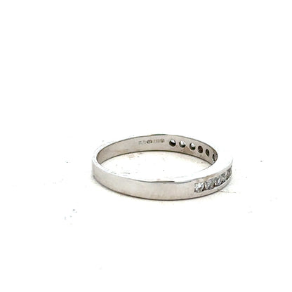18ct white gold diamond ring in size J with sparkling diamonds, showcasing elegant craftsmanship and a sleek design.