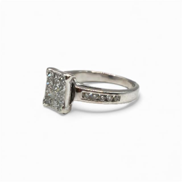 18ct white gold diamond ring in size J1/2 with sparkling diamonds, featuring a sleek and elegant design.