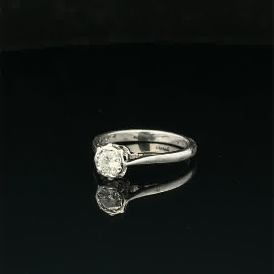 18ct white gold diamond ring in size K with sparkling diamonds, elegant jewelry piece on a neutral background.