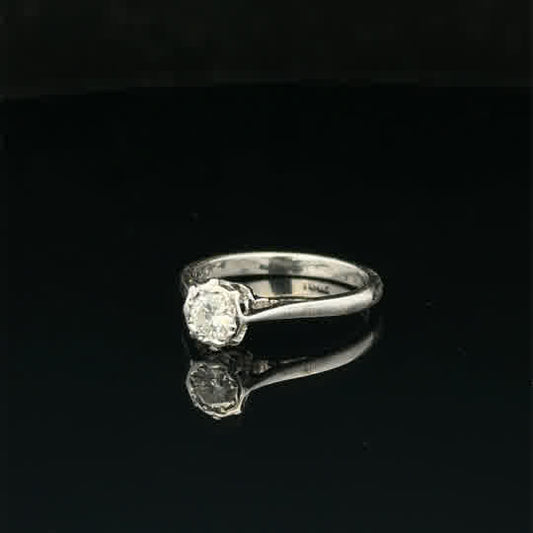18ct white gold diamond ring in size K with sparkling diamonds, elegant jewelry piece on a neutral background.