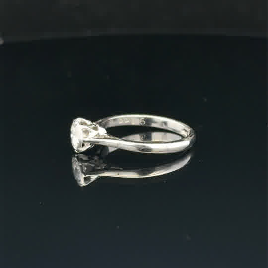 18ct white gold diamond ring size K, unbranded, featuring a sparkling diamond set in a sleek band, close-up view of the ring.