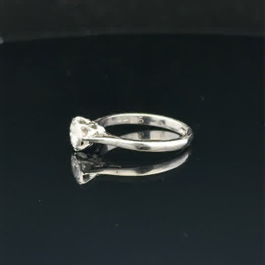 18ct white gold diamond ring size K, unbranded, featuring a sparkling diamond set in a sleek band, close-up view of the ring.