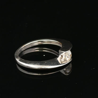 Unbranded 18ct white gold diamond ring size K1/2, showcasing a sparkling diamond design on a polished band.