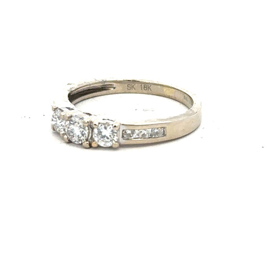 18ct white gold diamond ring size L with sparkling diamonds, shown from a side view highlighting the elegant band design.