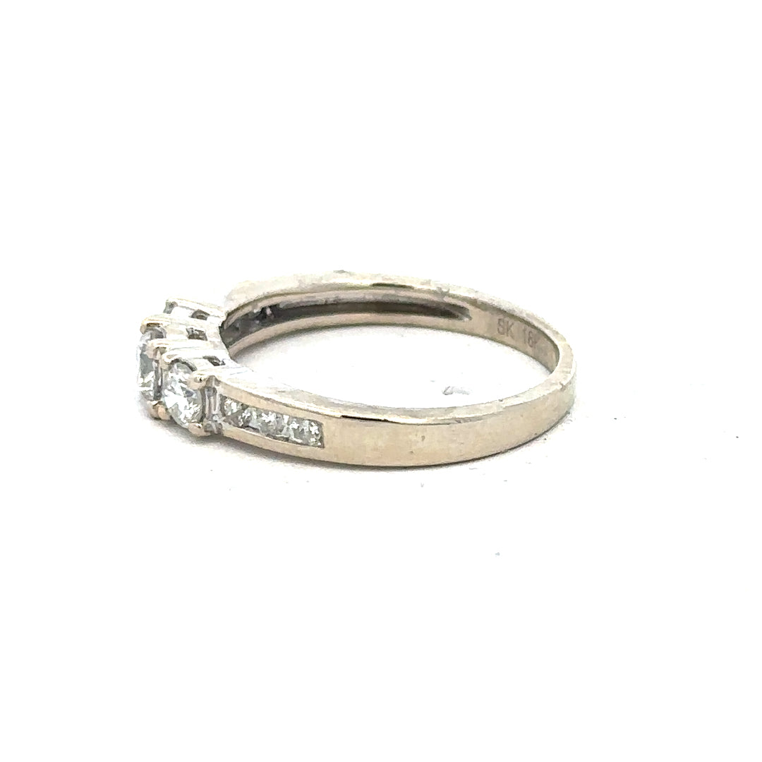 18ct white gold diamond ring in size L with sparkling diamonds, showcasing elegant jewelry design.