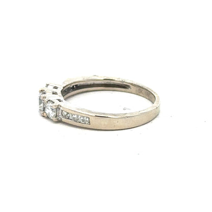 18ct white gold diamond ring in size L with sparkling diamonds, showcasing elegant jewelry design.