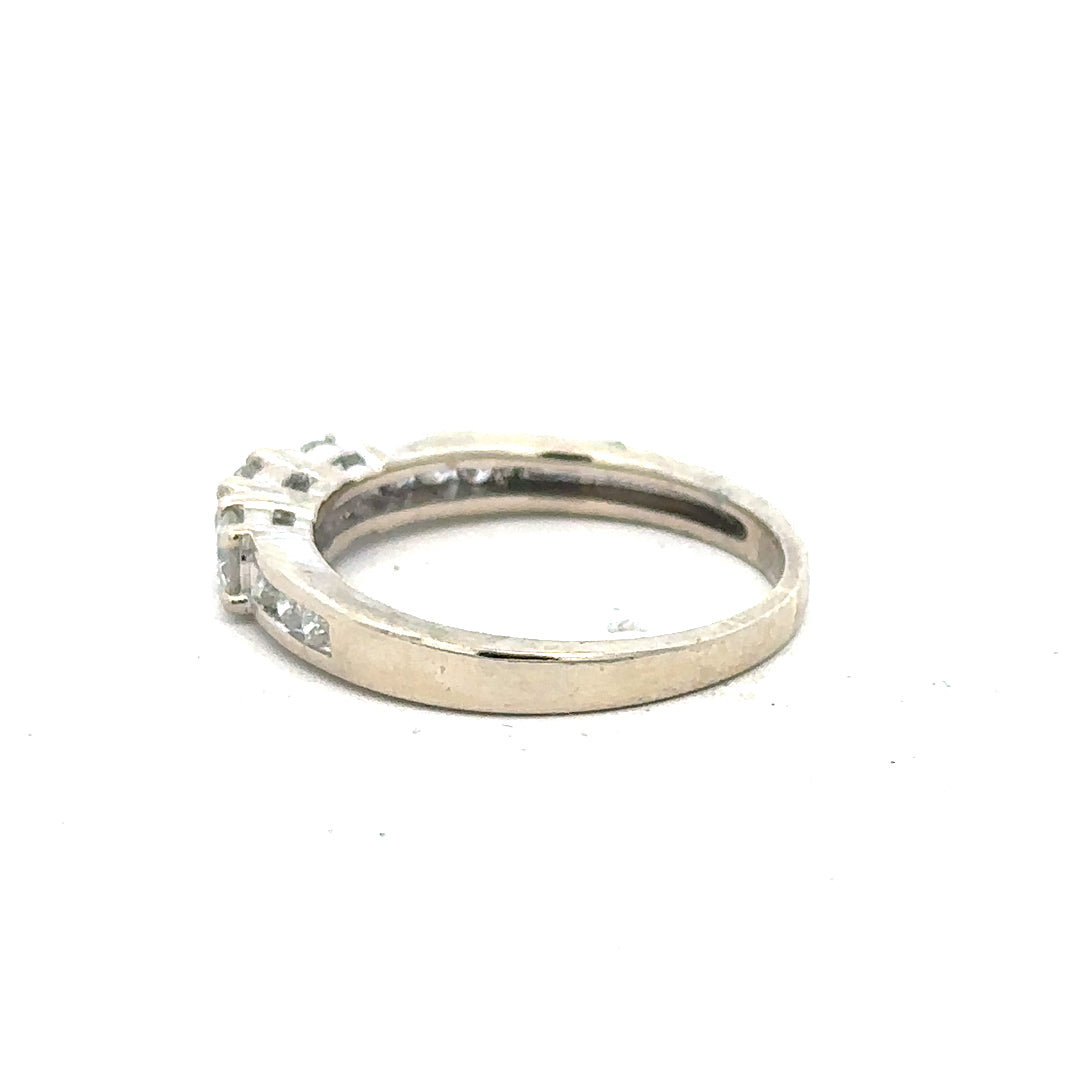 18ct white gold diamond ring in size L with sparkling diamonds, unbranded jewelry piece with elegant design.