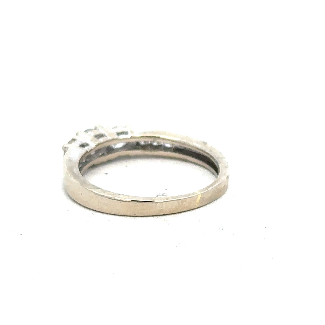 18ct white gold diamond ring in size L with sparkling diamonds, showcasing elegant jewelry design.