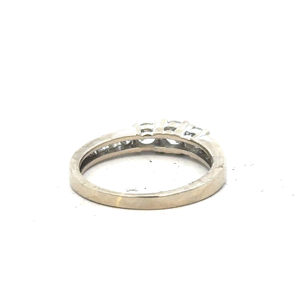 18ct white gold diamond ring in size L with sparkling diamonds, showcasing elegant craftsmanship and classic design.