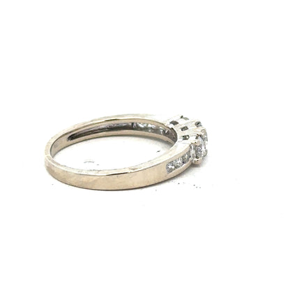 18ct white gold diamond ring in size L featuring sparkling diamonds and a sleek band design.