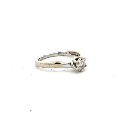 18ct white gold diamond ring in size N, featuring a sparkling central diamond and intricate band design.