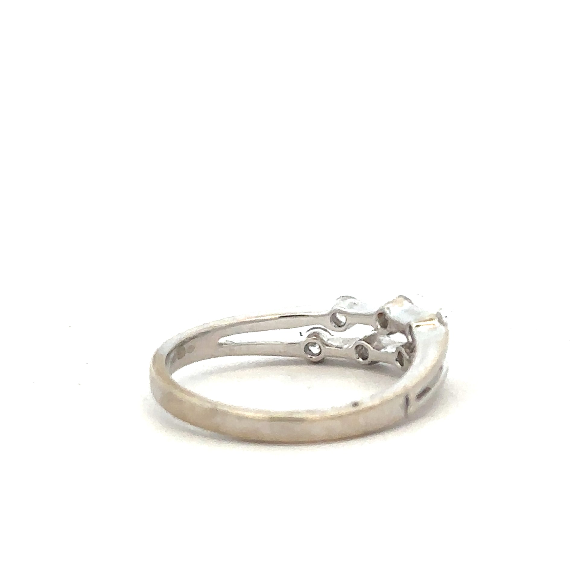 18ct white gold diamond ring in size O with sparkling diamonds, elegant jewelry piece with a sleek design.