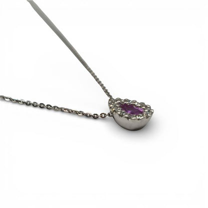 18ct white gold pendant with pink sapphire and diamond accents, showcasing elegant jewelry design.