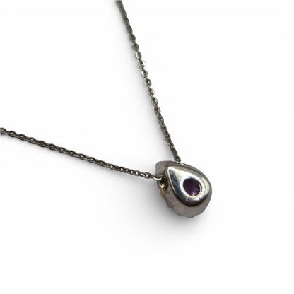 18ct white gold pendant with pink sapphire and diamonds, featuring a delicate design with sparkling gemstones.