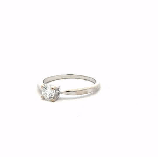 18ct white gold ring size J1/2 with a sleek, polished band, unbranded jewelry, shown on a neutral background.