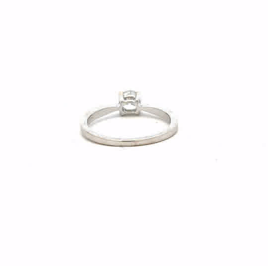 18ct white gold ring size J1/2 with a smooth polished band, unbranded jewelry, shown from a side angle.