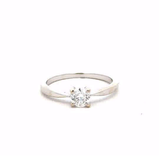 18ct white gold ring in size J1/2 with a sleek, polished finish, unbranded, displayed against a neutral background.