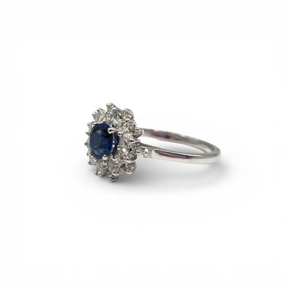 18ct white gold sapphire and diamond ring with intricate detailing, showcasing a stunning central sapphire gemstone.