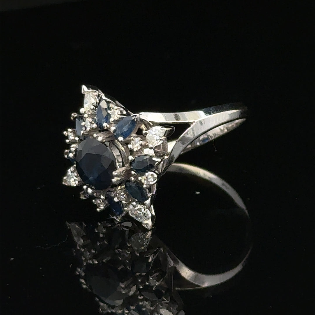 18ct white gold sapphire and diamond ring, size N1/2, featuring a sparkling gemstone and elegant design.