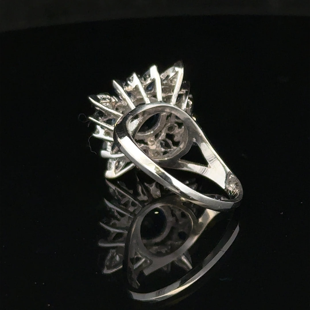 18ct white gold sapphire and diamond ring, size N1/2, showcasing a sparkling central sapphire with diamond accents.