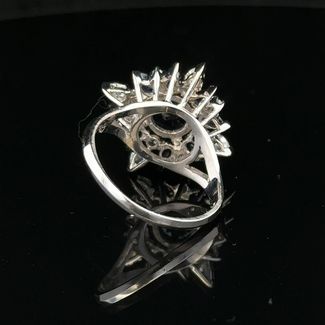 Elegant 18ct white gold sapphire and diamond ring in size N1/2, featuring a sparkling central sapphire and surrounding diamonds.