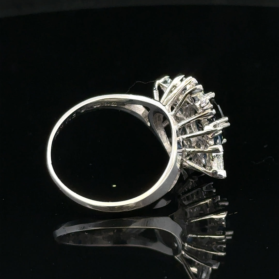 18ct white gold sapphire and diamond ring in size N1/2, featuring a sparkling gemstone and elegant design.