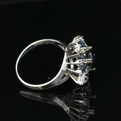 18ct white gold sapphire and diamond ring, size N1/2, featuring a central sapphire and sparkling diamonds.