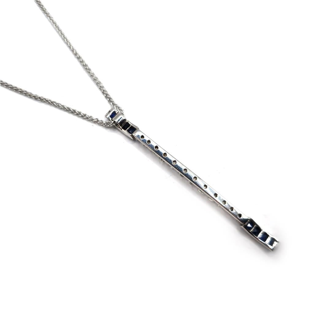 18ct white gold sapphire and diamond pendant with matching chain, elegant jewelry piece featuring a sparkling gemstone design.