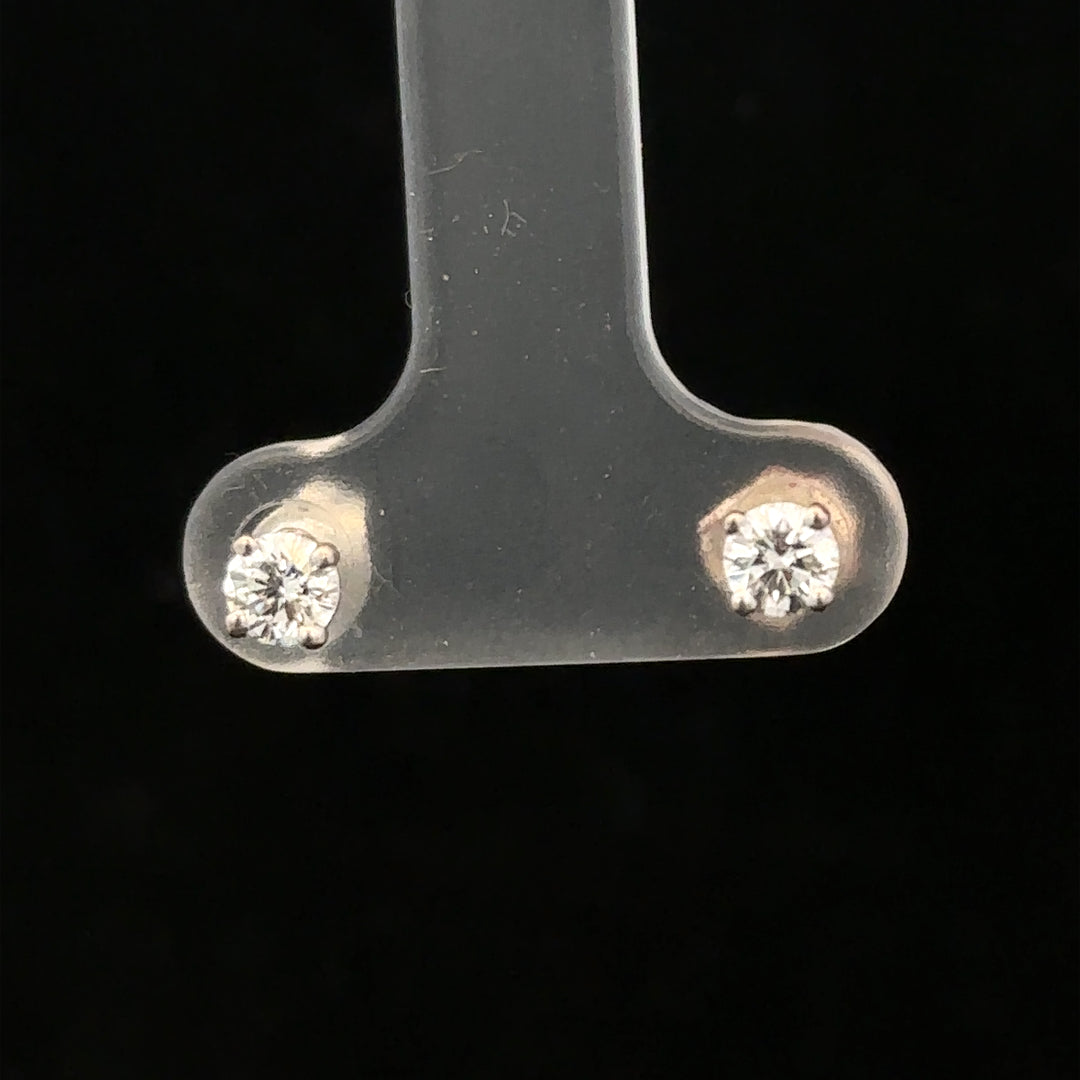 18ct white gold diamond stud earrings with 0.40 carats, featuring classic round-cut diamonds and a secure stud setting.