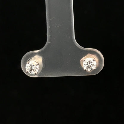 18ct white gold diamond stud earrings with 0.40 carats, featuring classic round-cut diamonds and a secure stud setting.