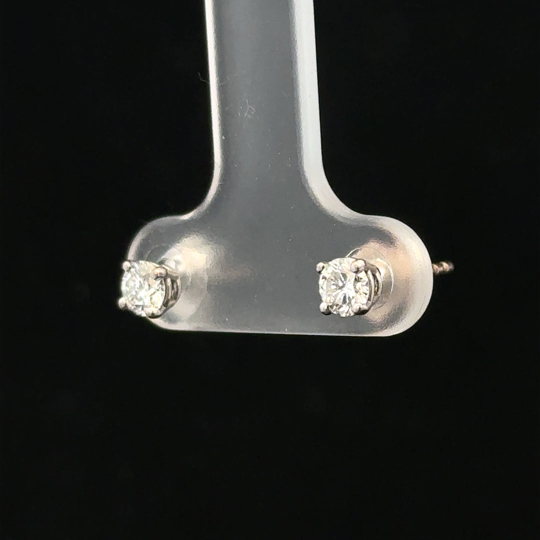 18ct white gold diamond stud earrings with 0.40 carat diamonds, featuring a classic and elegant design.