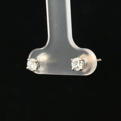 18ct white gold diamond stud earrings with 0.40 carat diamonds, featuring a classic and elegant design.
