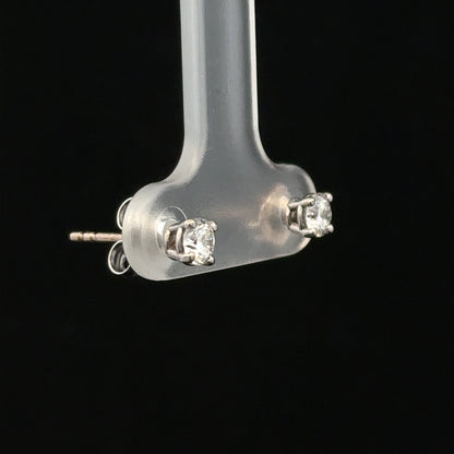 18ct white gold diamond stud earrings with 0.40 carats, featuring classic round-cut diamonds and a secure post back design.