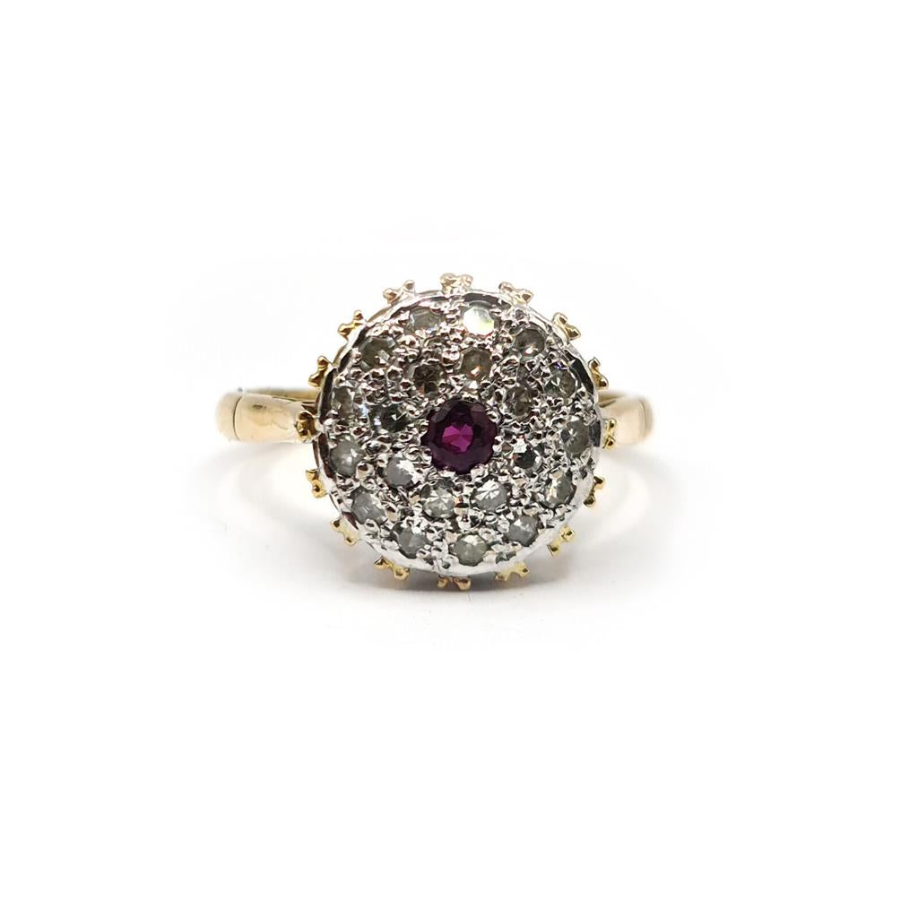 18ct yellow gold ruby and diamond cluster ring in size Q, featuring a central ruby surrounded by sparkling diamonds.
