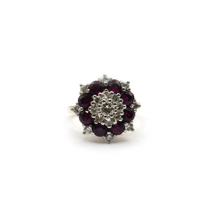 18ct yellow gold ring featuring a 0.25 carat ruby and 0.90 carat diamond accents, showcasing elegant jewelry design.