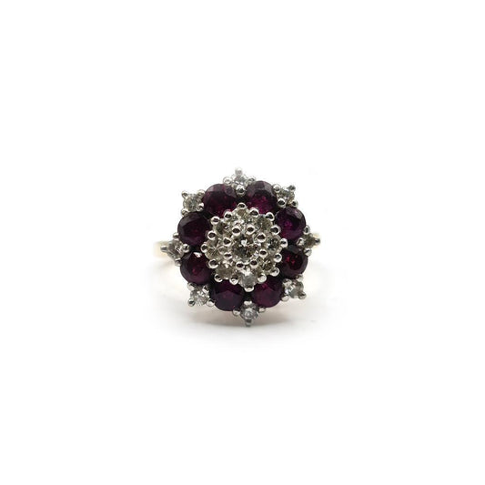 18ct yellow gold ring featuring a 0.25 carat ruby and 0.90 carat diamond accents, showcasing elegant jewelry design.